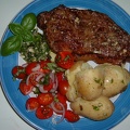 BBQ d sirloin with salsa verde  tomato basil salad and pots