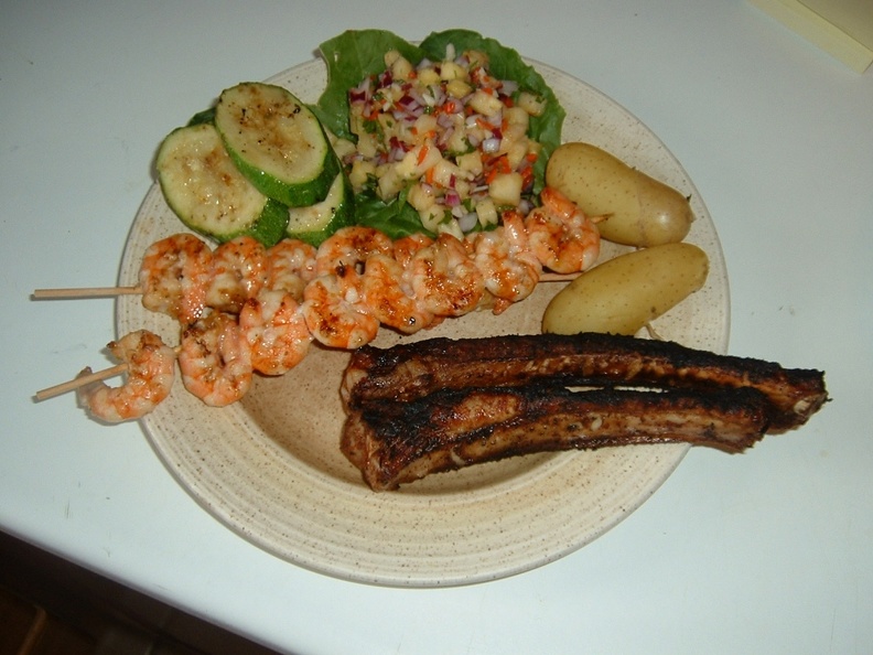 Ribs_with_spicy_rub__Chinese_prawns_and_new_potatoes_with_courgette_and_a_pineapple_bonnet_salsa.JPG