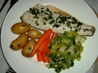 Grilled sea bass with minted new potatoes  glazed carrots and creamy leeks