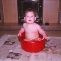 27 9.5 months having bath in the red bowl