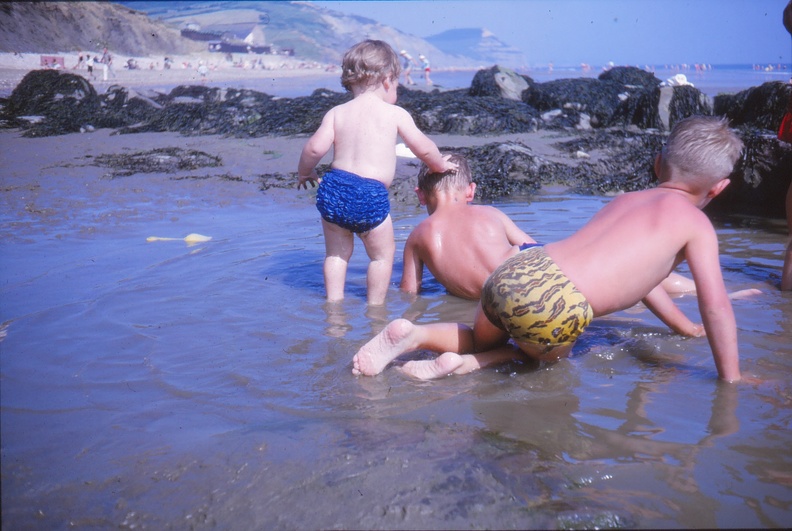 26 Wendy playing in a rock pool with little boys