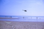 25 Helicopter flying over the beach
