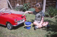 07 D washing his pedal car