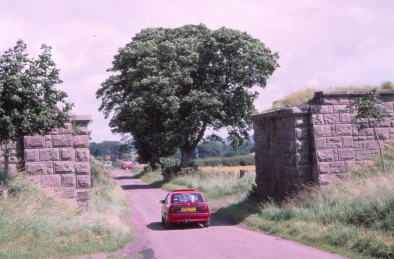 48 Cassie driving 'under' missing railway bridge at Wooler.jpg